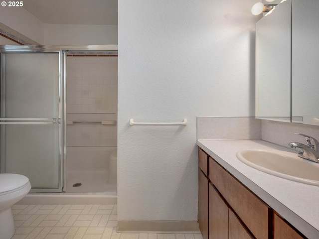 18036 NW Emmaus Ln, Portland, OR 97231 - full bath featuring a stall shower, vanity, and toilet