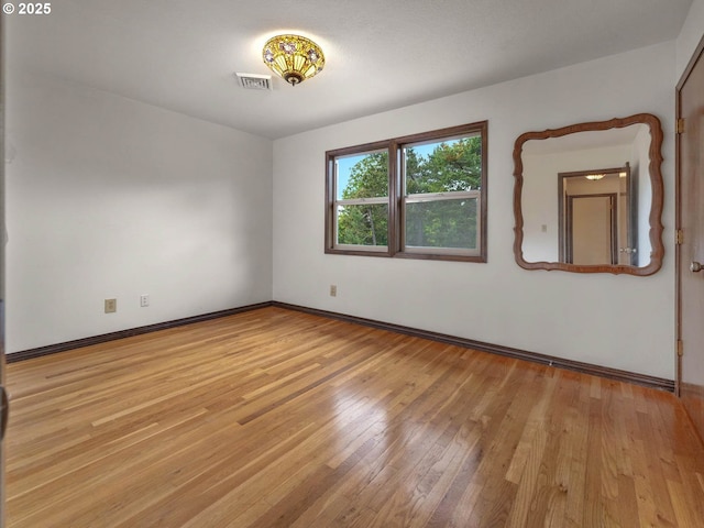 18036 NW Emmaus Ln, Portland, OR 97231 - spare room featuring light wood-style flooring and baseboards