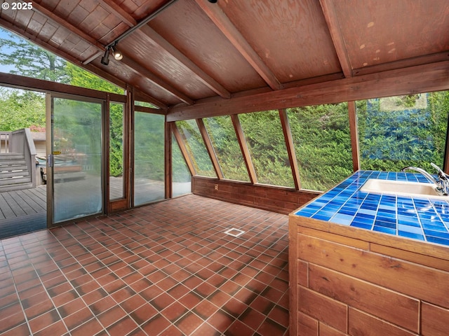 18036 NW Emmaus Ln, Portland, OR 97231 - unfurnished sunroom featuring a sink and plenty of natural light
