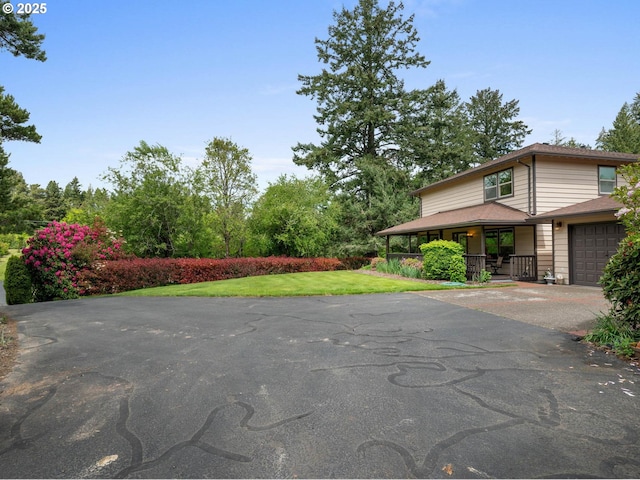18036 NW Emmaus Ln, Portland, OR 97231 - view of green lawn with covered porch and driveway