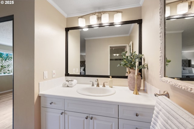 bathroom featuring vanity and crown molding