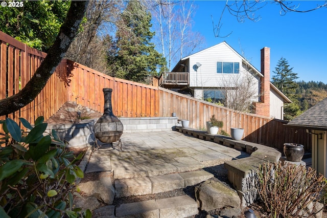 view of patio / terrace with a fire pit