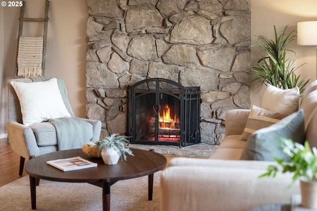 living area featuring light hardwood / wood-style flooring and a fireplace