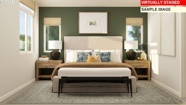 bedroom featuring carpet and baseboards