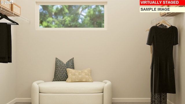 interior space featuring baseboards and carpet flooring