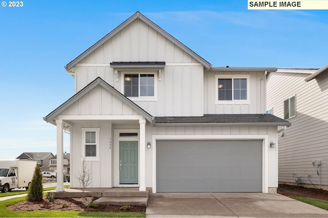 modern farmhouse featuring concrete driveway, an attached garage, board and batten siding, and a shingled roof