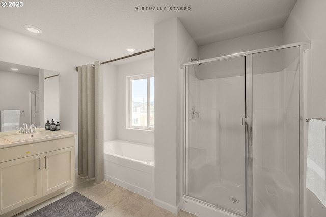 full bathroom featuring a bath, recessed lighting, a shower stall, and vanity