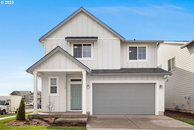 modern farmhouse style home with driveway, board and batten siding, an attached garage, and a shingled roof