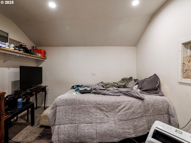 bedroom featuring vaulted ceiling and recessed lighting