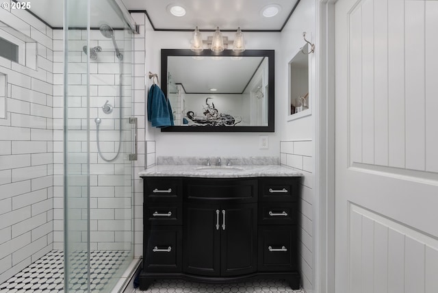 full bathroom featuring a shower stall and vanity