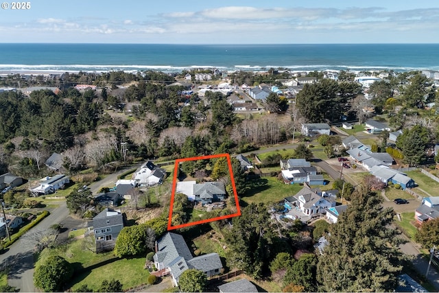 bird's eye view with a residential view and a water view