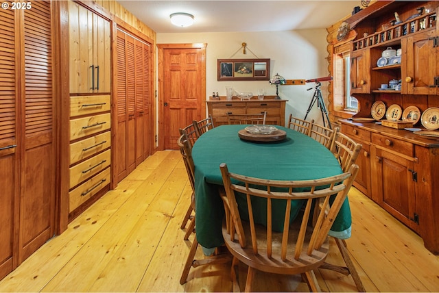 dining area featuring light wood finished floors
