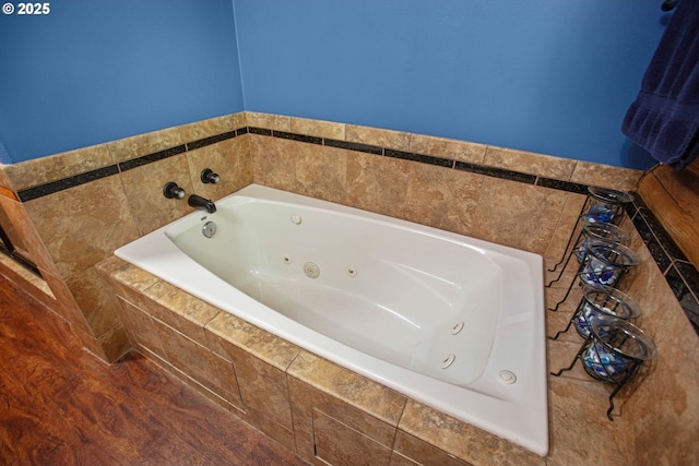 bathroom featuring a tub with jets