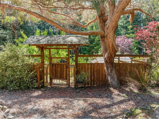 view of yard featuring a gate and fence