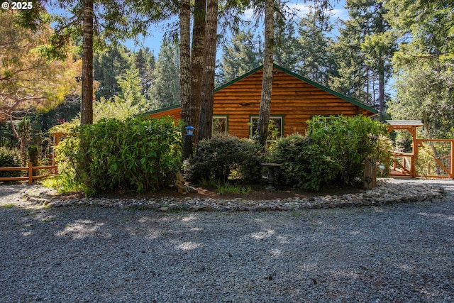 view of side of home with fence