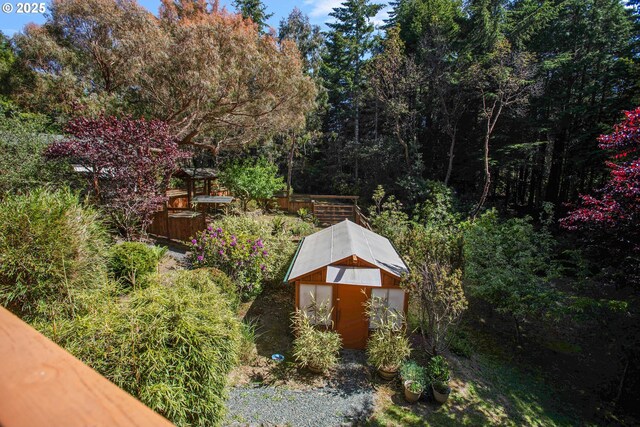 exterior space with an outbuilding and a storage shed