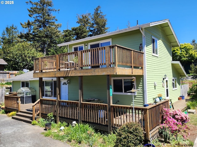 back of property with a deck
