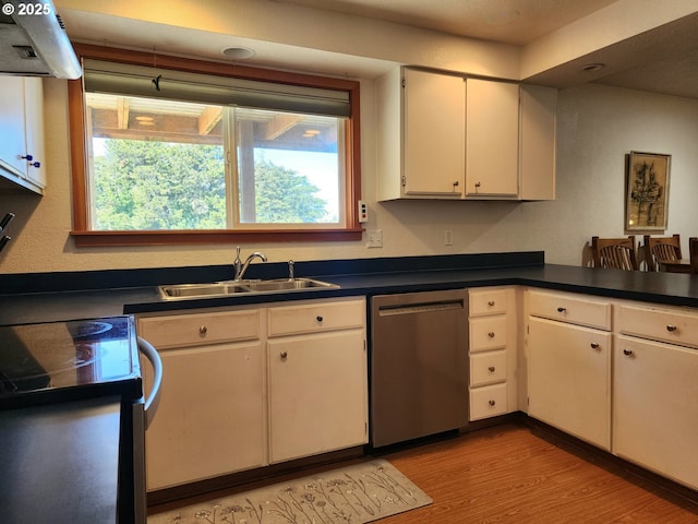 kitchen featuring light wood-style flooring, a sink, dark countertops, range hood, and dishwasher