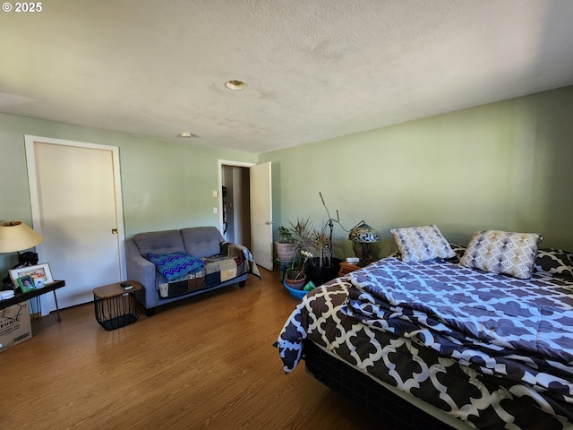 bedroom featuring wood finished floors