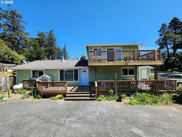traditional home with a wooden deck