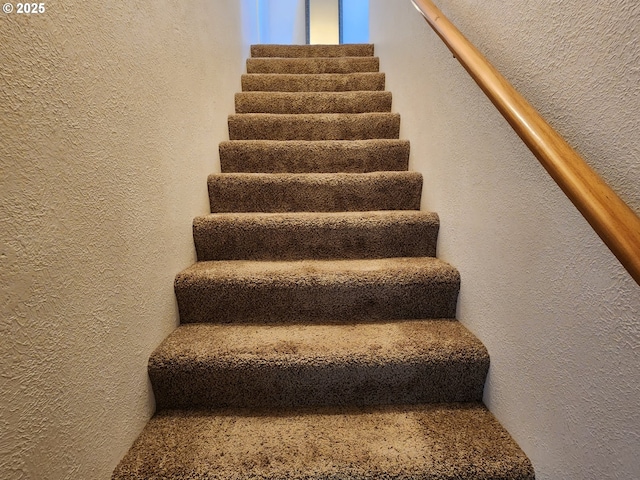 stairs with a textured wall