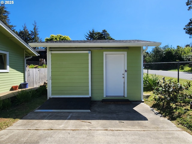 view of shed with fence