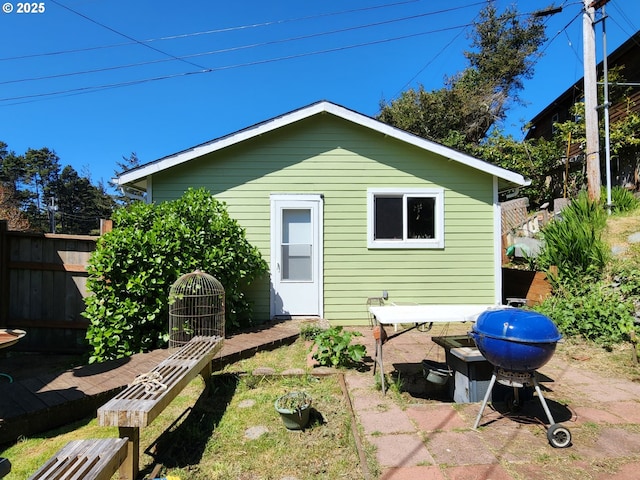rear view of property with fence
