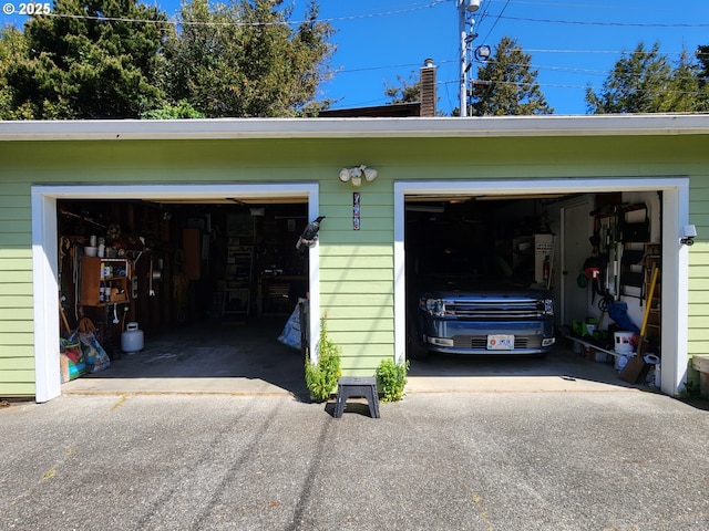 garage featuring aphalt driveway