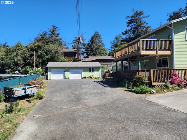 view of property exterior with an outbuilding and a wooden deck
