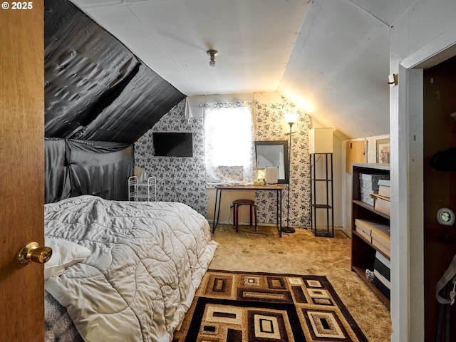 bedroom with carpet and vaulted ceiling