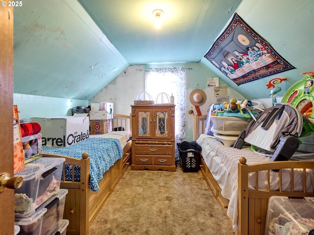 carpeted bedroom featuring lofted ceiling