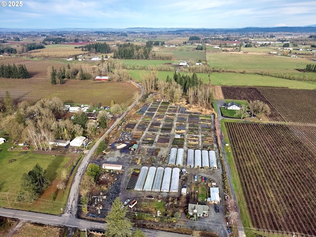 birds eye view of property with a rural view