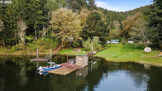 1298 N Tenmile, Lakeside, OR 97449 - view of dock with a water view, a view of trees, and a lawn