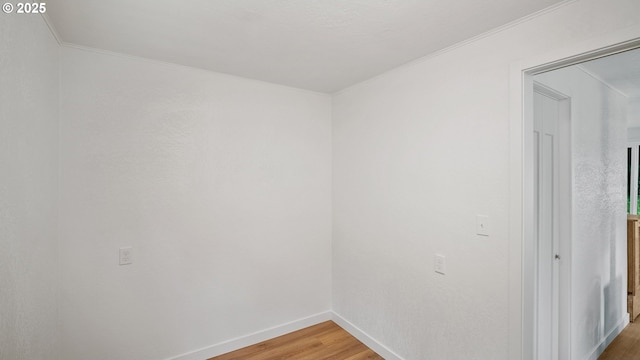 1298 N Tenmile, Lakeside, OR 97449 - unfurnished room featuring light wood-style flooring, baseboards, and ornamental molding