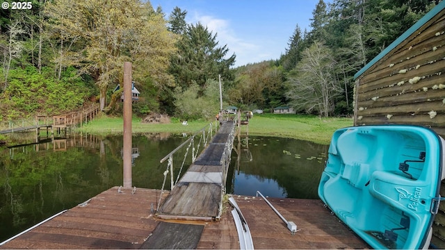1298 N Tenmile, Lakeside, OR 97449 - dock area with a water view and a view of trees