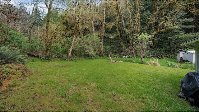 1298 N Tenmile, Lakeside, OR 97449 - view of yard featuring an outbuilding and a forest view