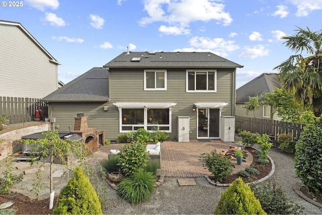 back of property featuring a patio and a fenced backyard