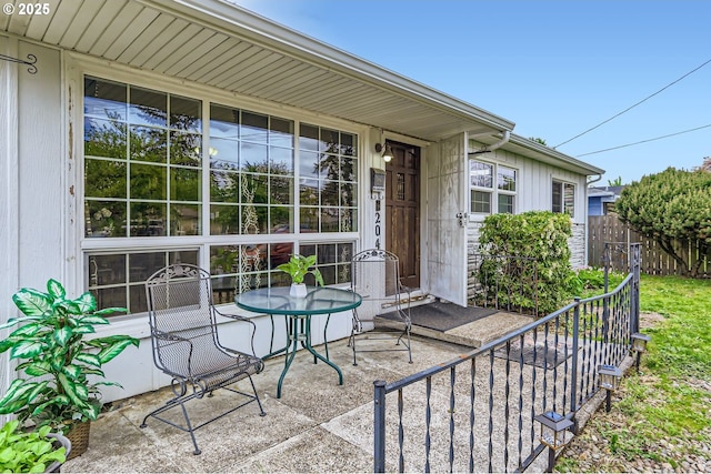 view of patio / terrace featuring fence