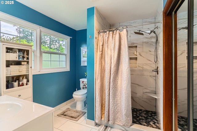 full bath featuring vanity, tile patterned floors, a stall shower, and toilet