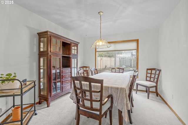 view of carpeted dining space