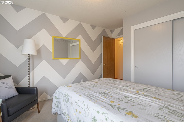 bedroom with carpet flooring and a closet