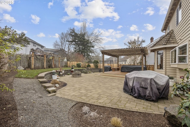 view of patio featuring a fire pit, a pergola, a grill, a wooden deck, and a hot tub