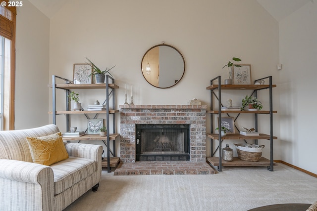 living room featuring a brick fireplace, carpet floors, and lofted ceiling