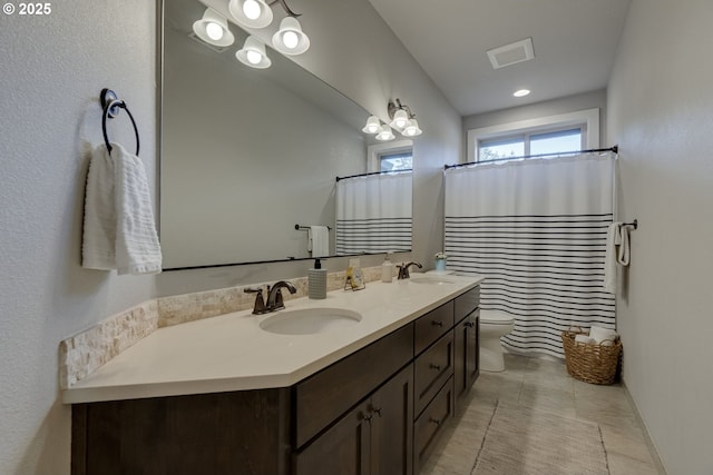 865 SW Trillium Ln, Portland, OR 97219 - bathroom with double vanity, a shower with shower curtain, and tile patterned floors