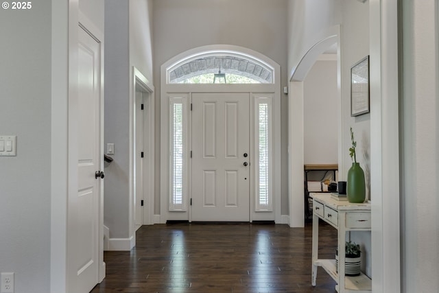 865 SW Trillium Ln, Portland, OR 97219 - foyer entrance featuring dark wood finished floors, healthy amount of natural light, and arched walkways