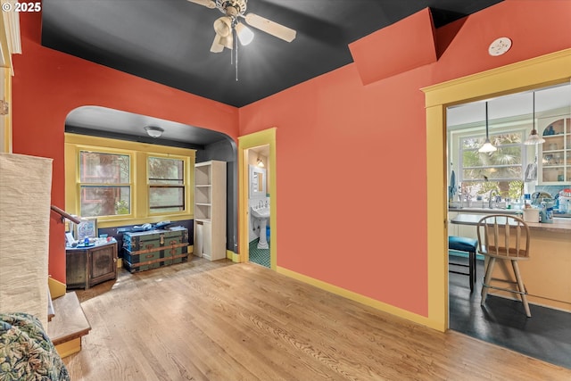 2516 NE Clackamas St, Portland, OR 97232 - living area featuring arched walkways, a ceiling fan, and wood finished floors