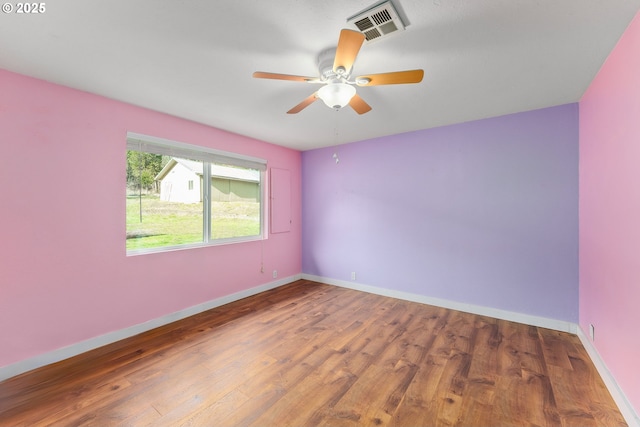 spare room featuring ceiling fan and wood-type flooring