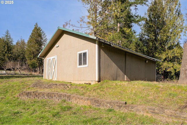 view of side of property with an outbuilding