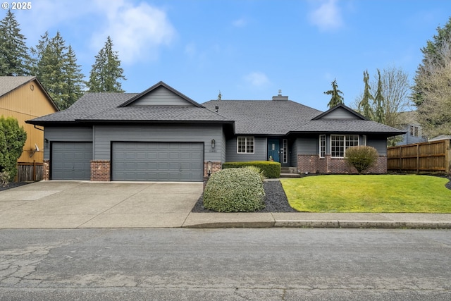 view of front of property featuring an attached garage, fence, and brick siding