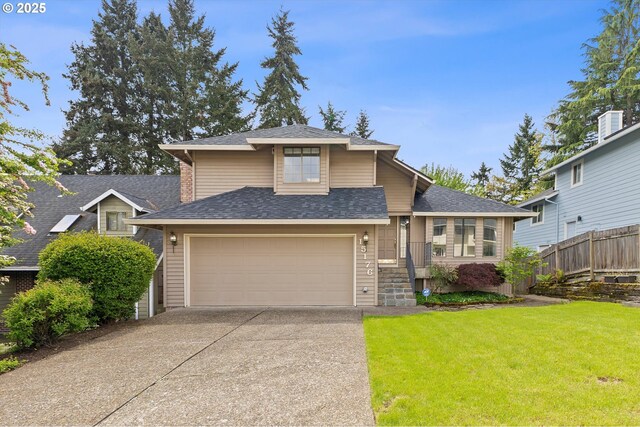 view of front of house featuring concrete driveway, fence, a shingled roof, and a front yard